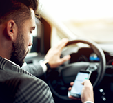 Man texting while driving