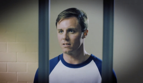 Young man behind bars